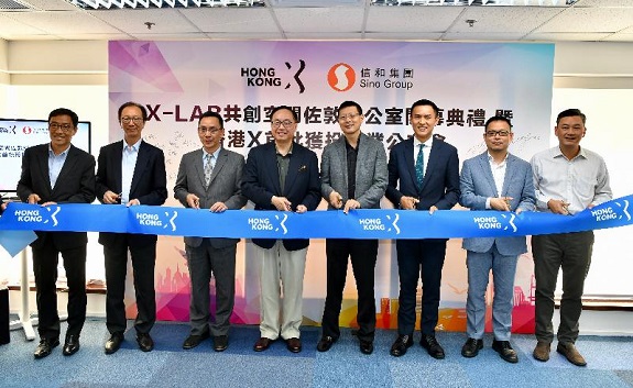 The Secretary for Innovation and Technology, Mr Nicholas W Yang (fourth left), today (August 12) officiates at a ribbon-cutting ceremony with the Chairman of the Hong Kong X-Tech Startup Platform (HKX), Mr Neil Shen (fourth right); the Director General of the Youth Department of the Liaison Office of the Central People's Government in the Hong Kong Special Administrative Region, Mr Chen Lin (third left); the Executive Assistant to Chairman of the Sino Group, Mr Alexander Ng (third right); the Group Chairman and Chief Executive Officer of the Nan Fung Group, Mr Antony Leung (second left); Co-founder of the HKX, Professor Chen Guanhua (second right); the Chief Executive Officer of the Hong Kong Science and Technology Parks Corporation, Mr Albert Wong (first left); and the Chief Executive Officer of the Hong Kong Cyberport Management Company Limited, Mr Herman Lam (first right), marking the opening of X-LAB Jordan office.